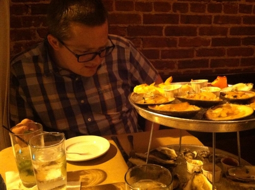 My husband eyeing up the tower of delicious things! He is so cute. 